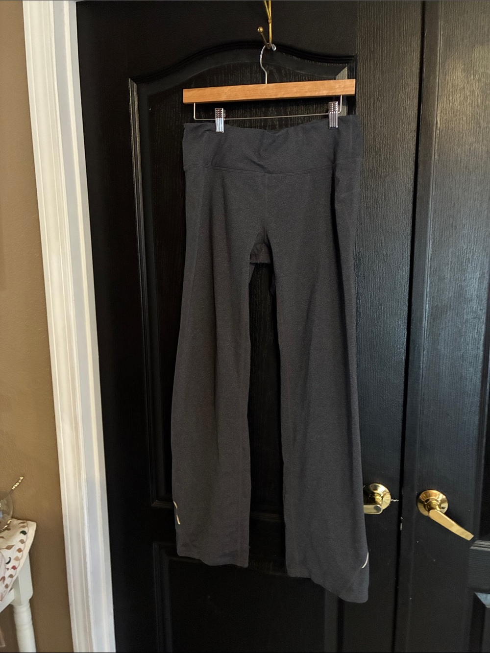 M Athleta womens  Black Performance Leggings with Logo.  Zip pocket back waist